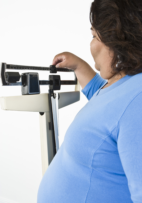 Woman using weight scales